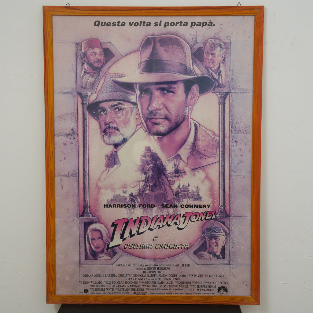 Locandina originale "Indiana Jones e l'Ultima Crociata" (1989) prima stampa italiana – illustrazione di Drew Struzan, cornice in legno – 99 x 72 cm